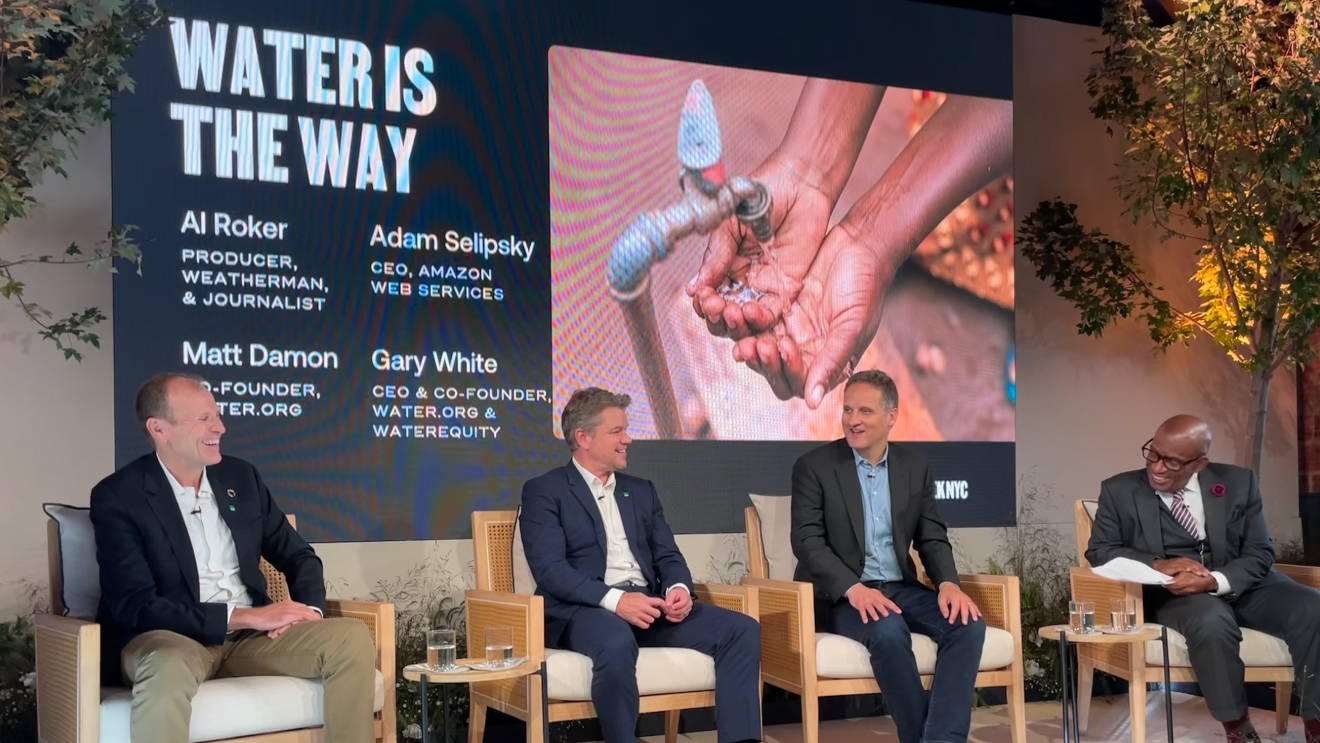 Adam Selipsky, Matt Damon, and Gary White on stage at The Climate Pledge Summit.