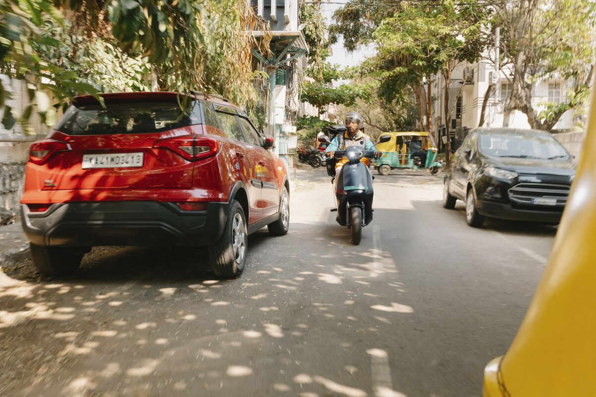 A motorcycle driving in traffic in Bengaluru, India 